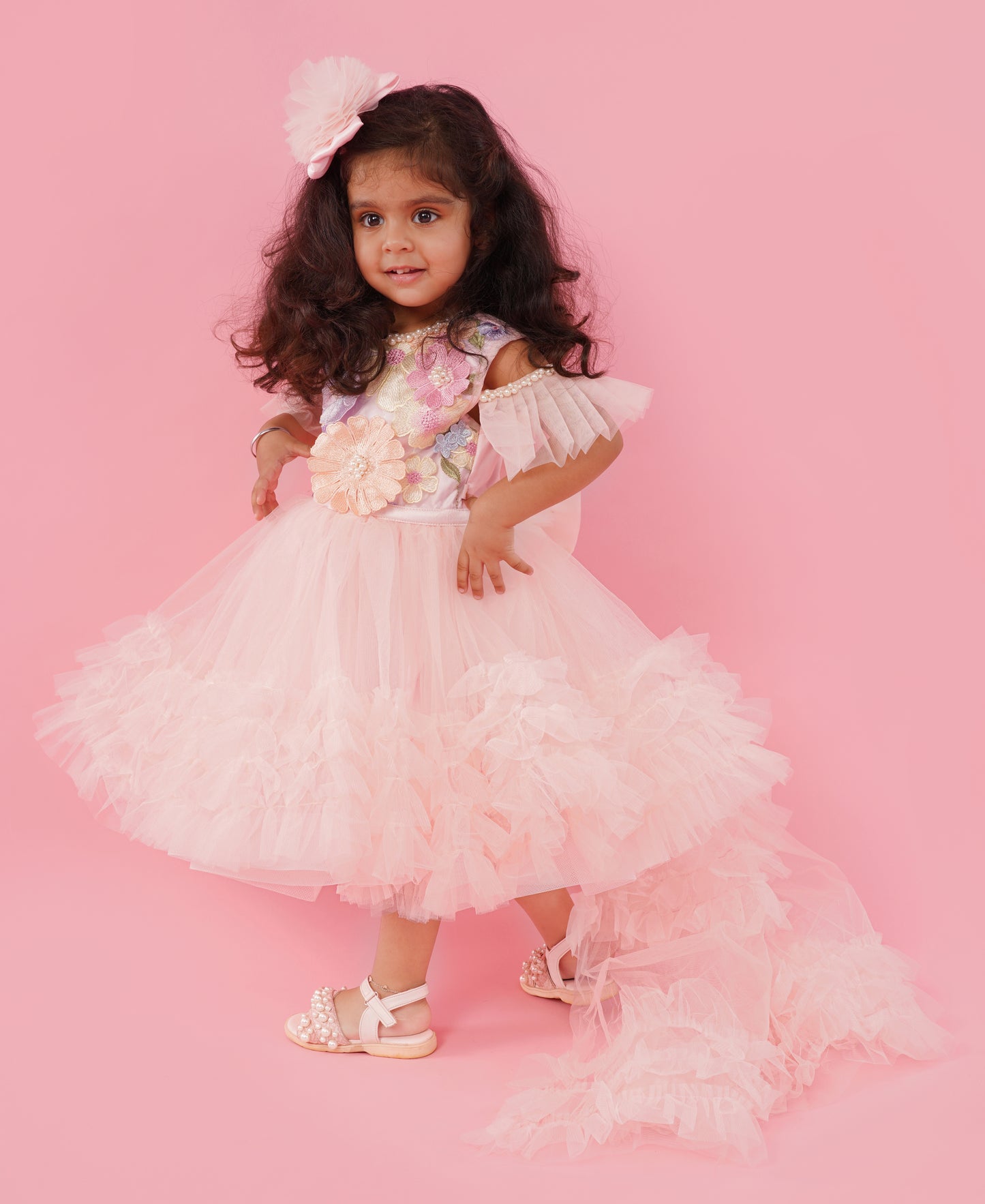 Blush pink floral couture high-low party gown for girls with embellished floral bodice and layered ruffle train