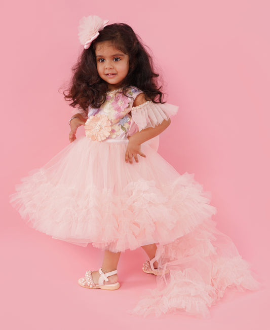 Blush pink floral couture high-low party gown for girls with embellished floral bodice and layered ruffle train