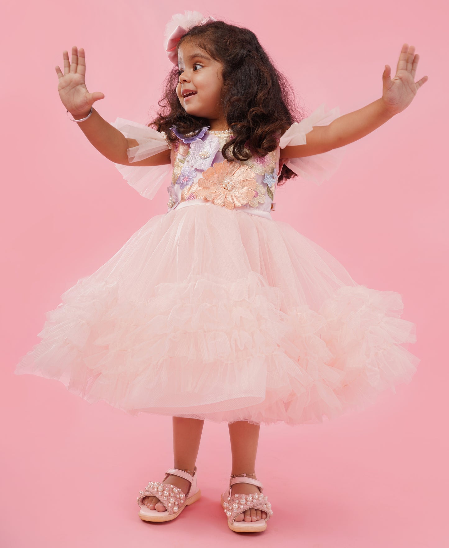 Blush pink floral couture high-low party gown for girls with embellished floral bodice and layered ruffle train 1