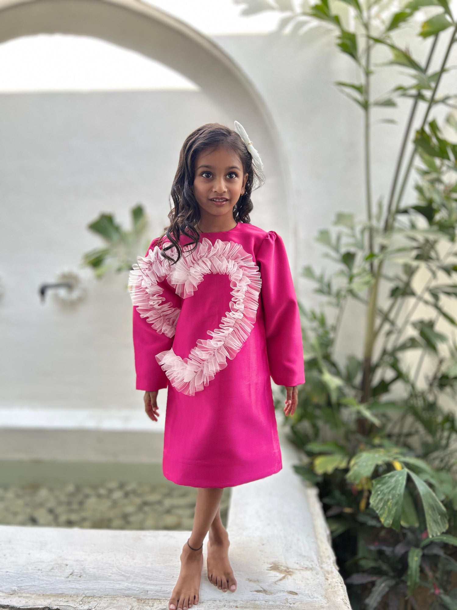 Fuchsia frilled heart party dress for girls with full sleeves and designer detailing