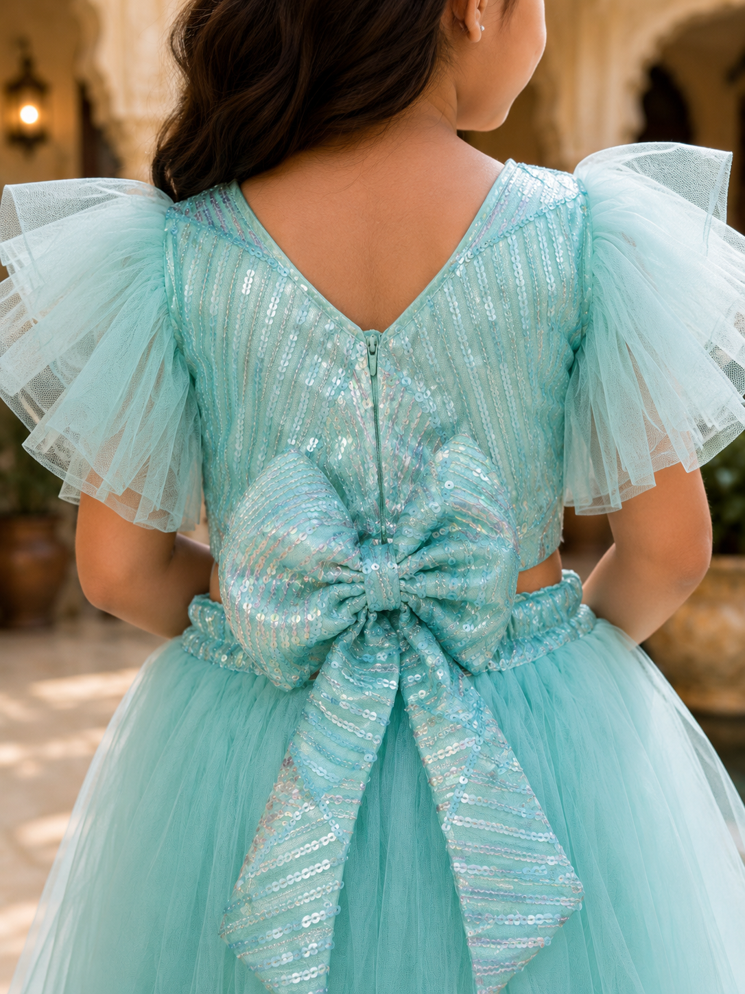 Girls_aqua_blue_embellished_tulle_lehenga_choli_set_with_statement_sleeves_and_tassel_detailing_3