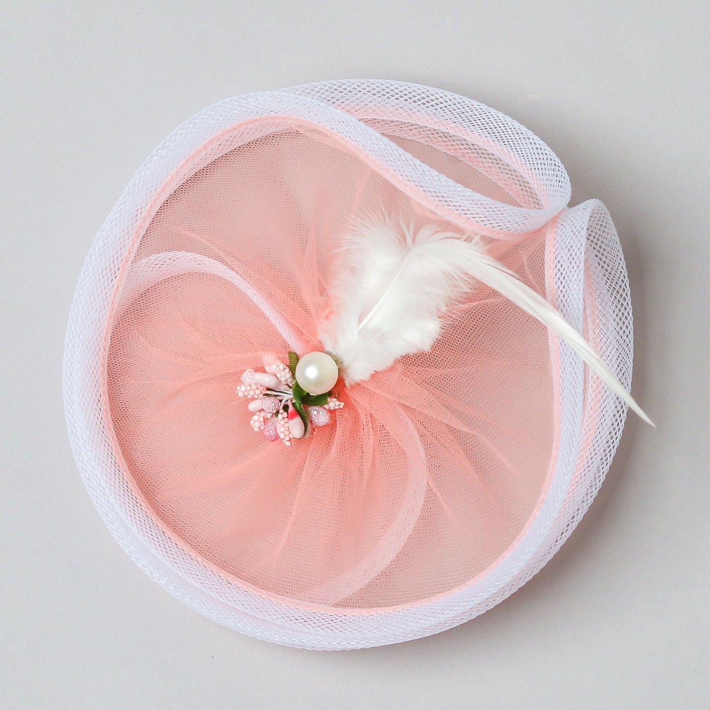 Fancy Twisted Salmon Pink Alligator Hair Fascinator