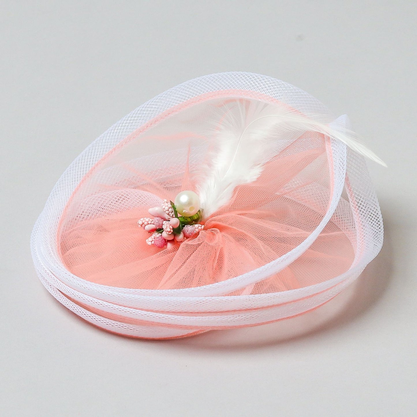 Fancy Twisted Salmon Pink Alligator Hair Fascinator