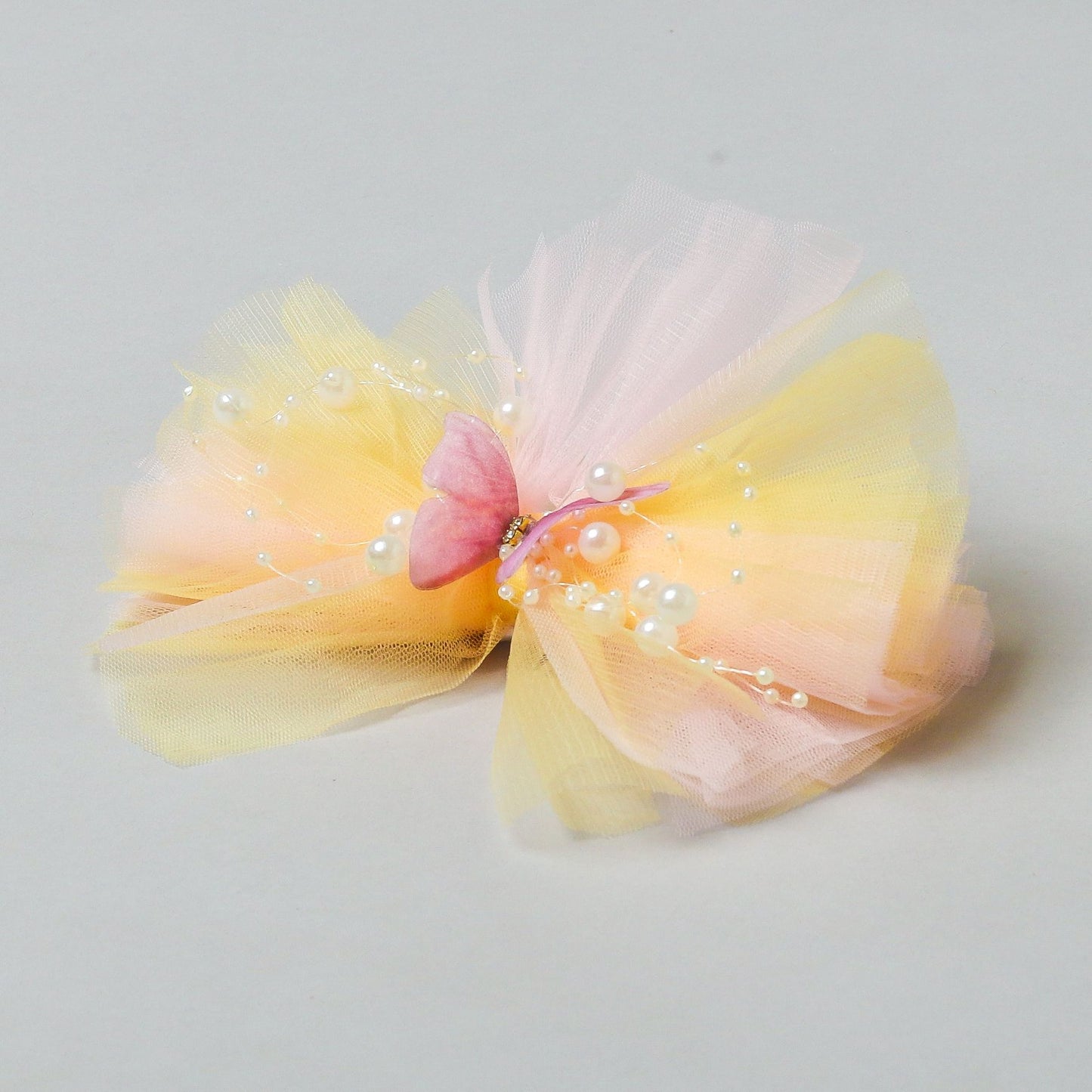 Butterfly Adorned Yellow And Pink Two Tone Frilly Hair Fascinator