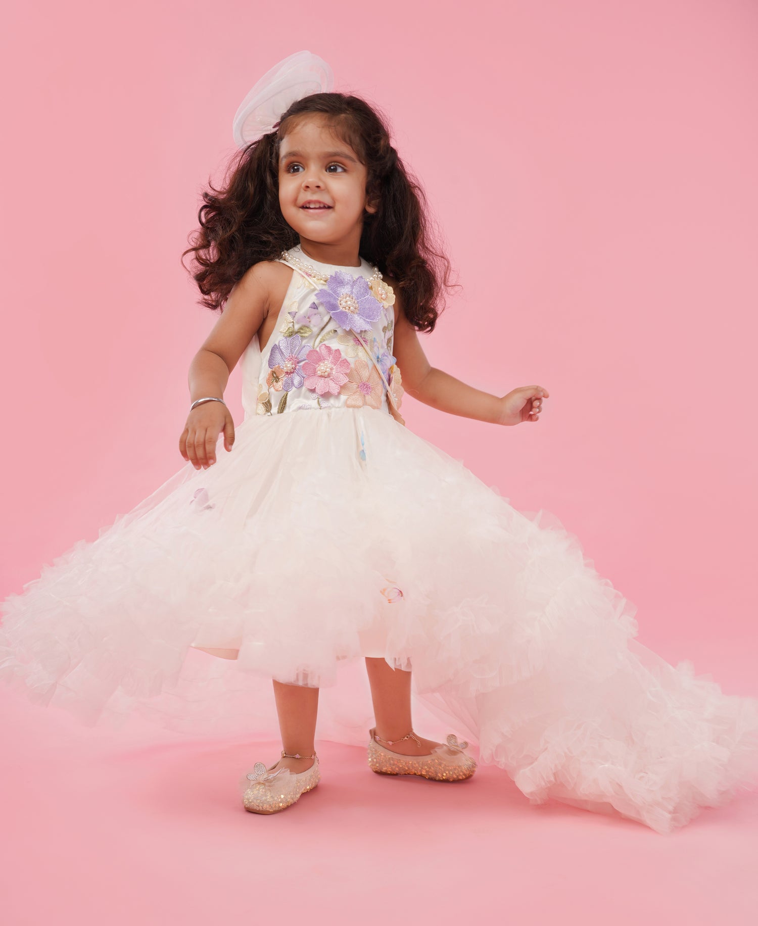 Ivory floral appliqué high-low party gown for girls with layered flare and couture detailing