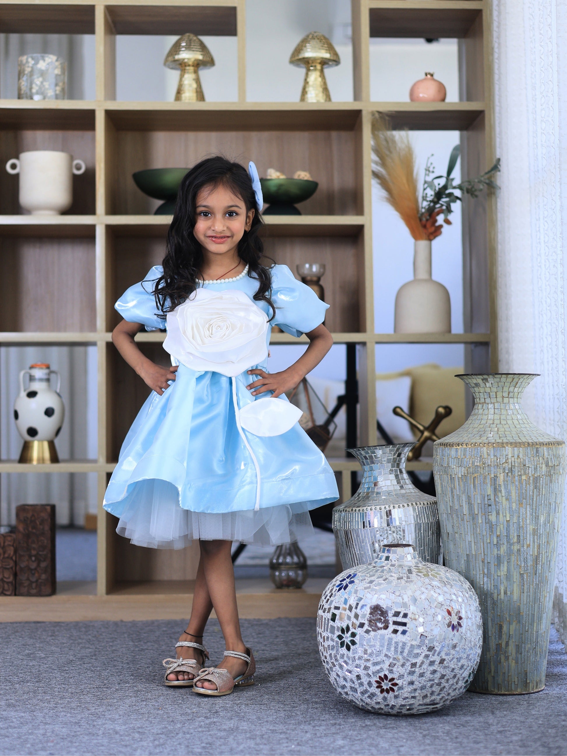 Powder blue party dress for girls with oversized rose appliqué, puff sleeves and layered tulle skirt