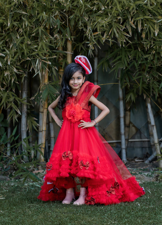 Red high-low party gown for girls with floral neckline, layered frill hem and dramatic back trail