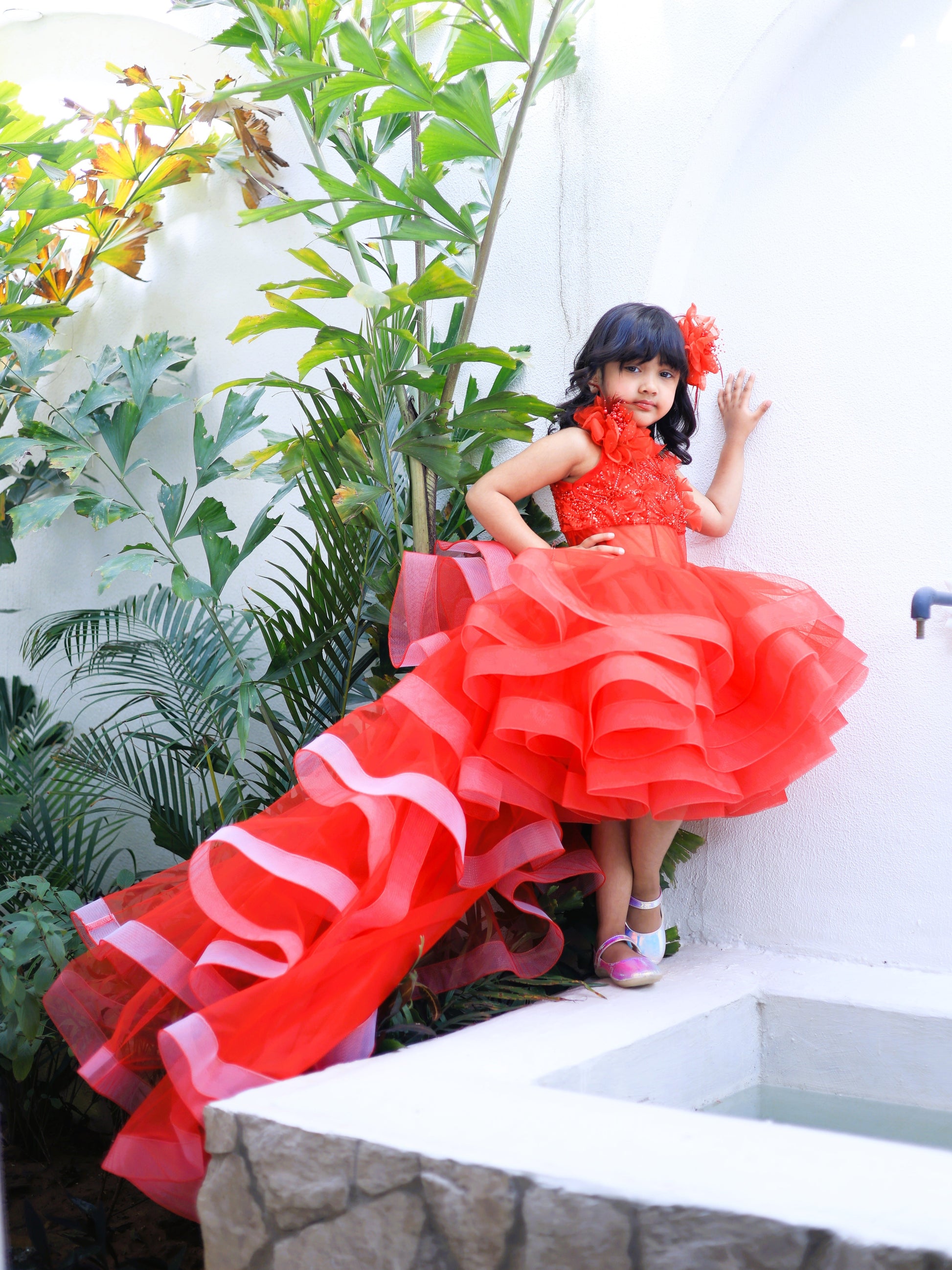 Red princess party dress for girls with detachable trail, floral embellishments and dramatic layered flare