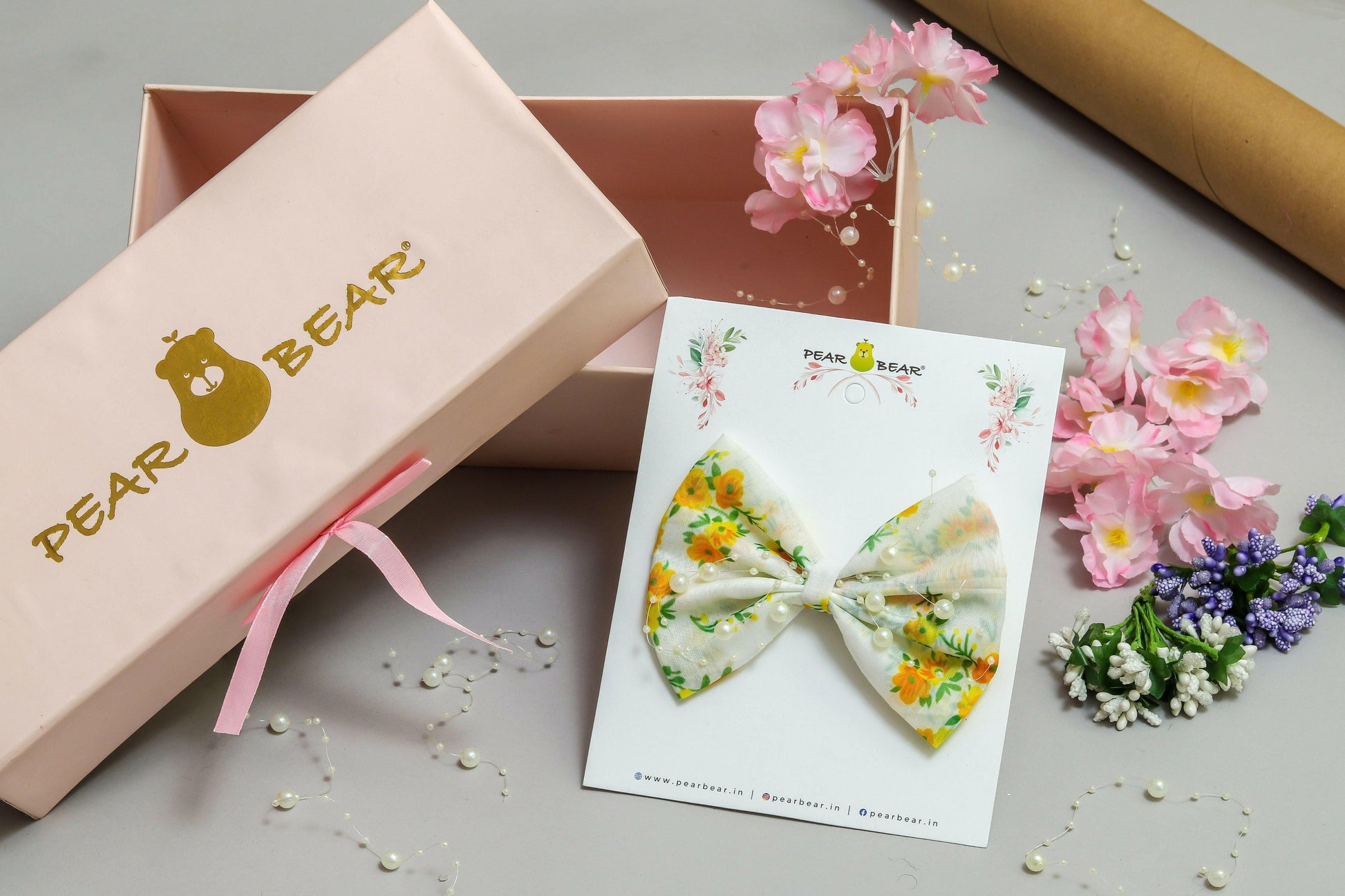 Pear Bear Beautiful flower print bow with pearl strings.