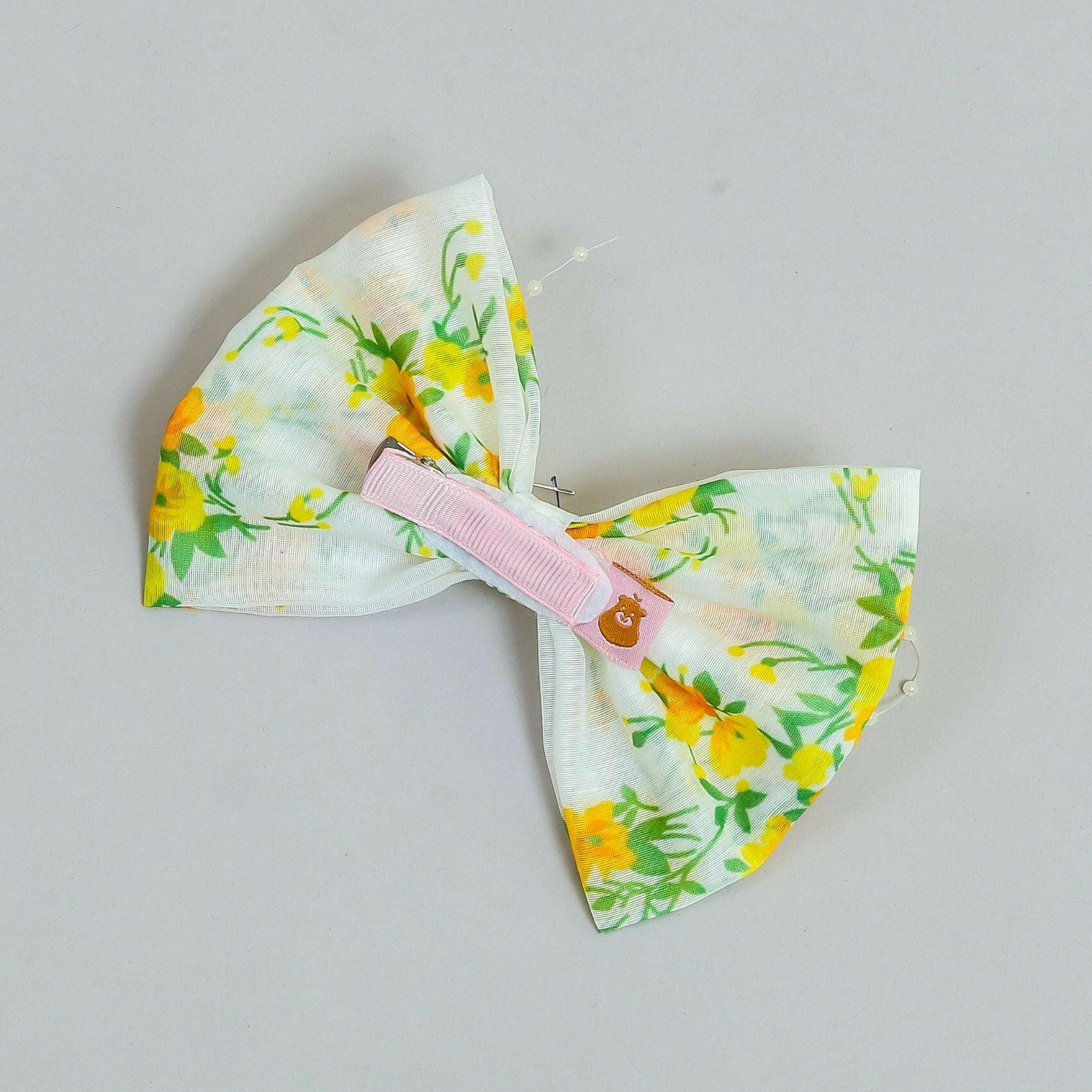 Pear Bear Beautiful flower print bow with pearl strings.