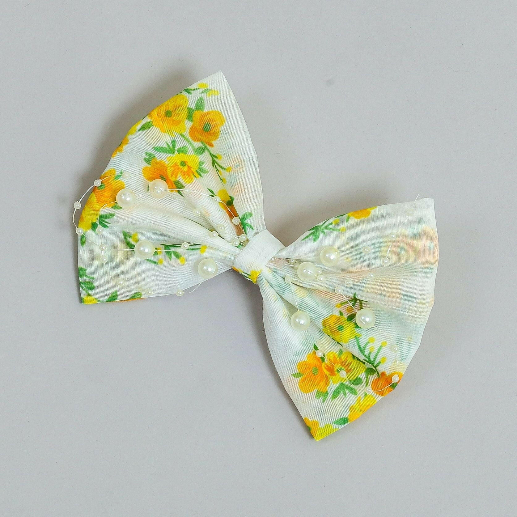 Pear Bear Beautiful flower print bow with pearl strings.
