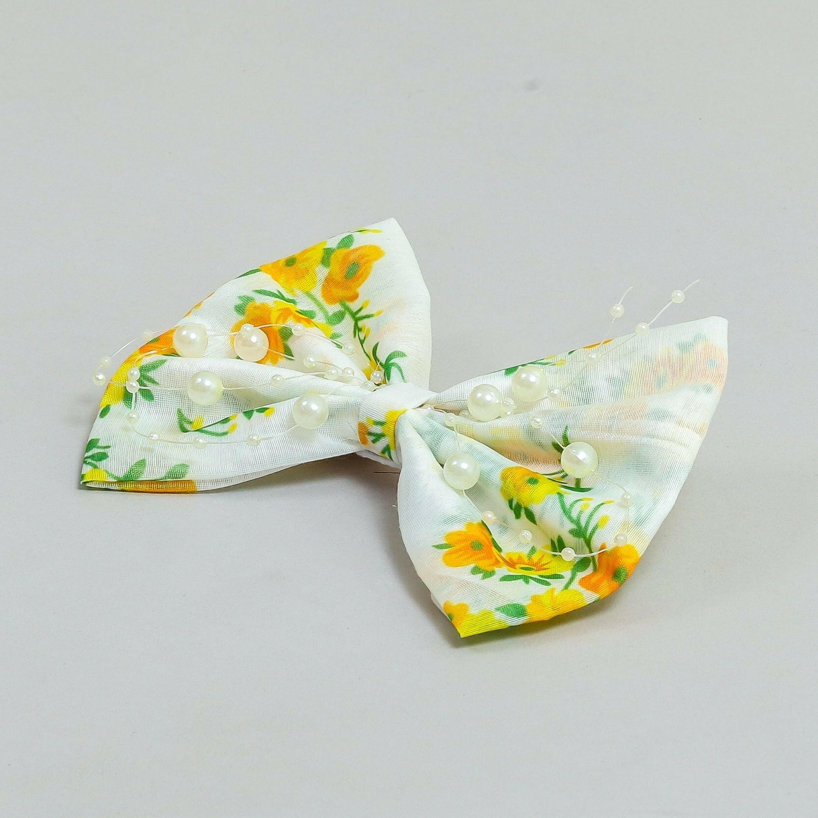 Pear Bear Beautiful flower print bow with pearl strings.