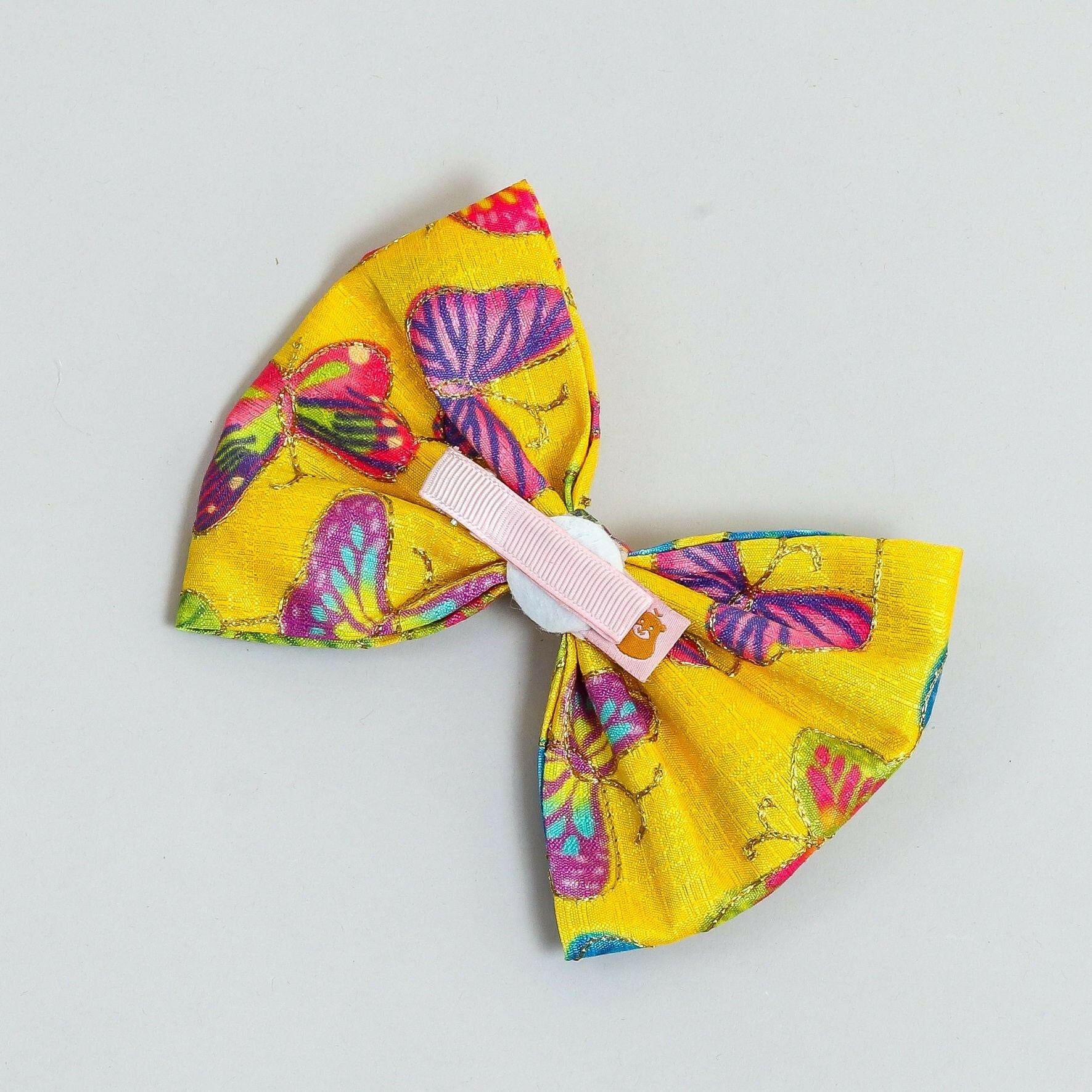 Pear Bear Beautiful hair bow with multi colour butterfly print.