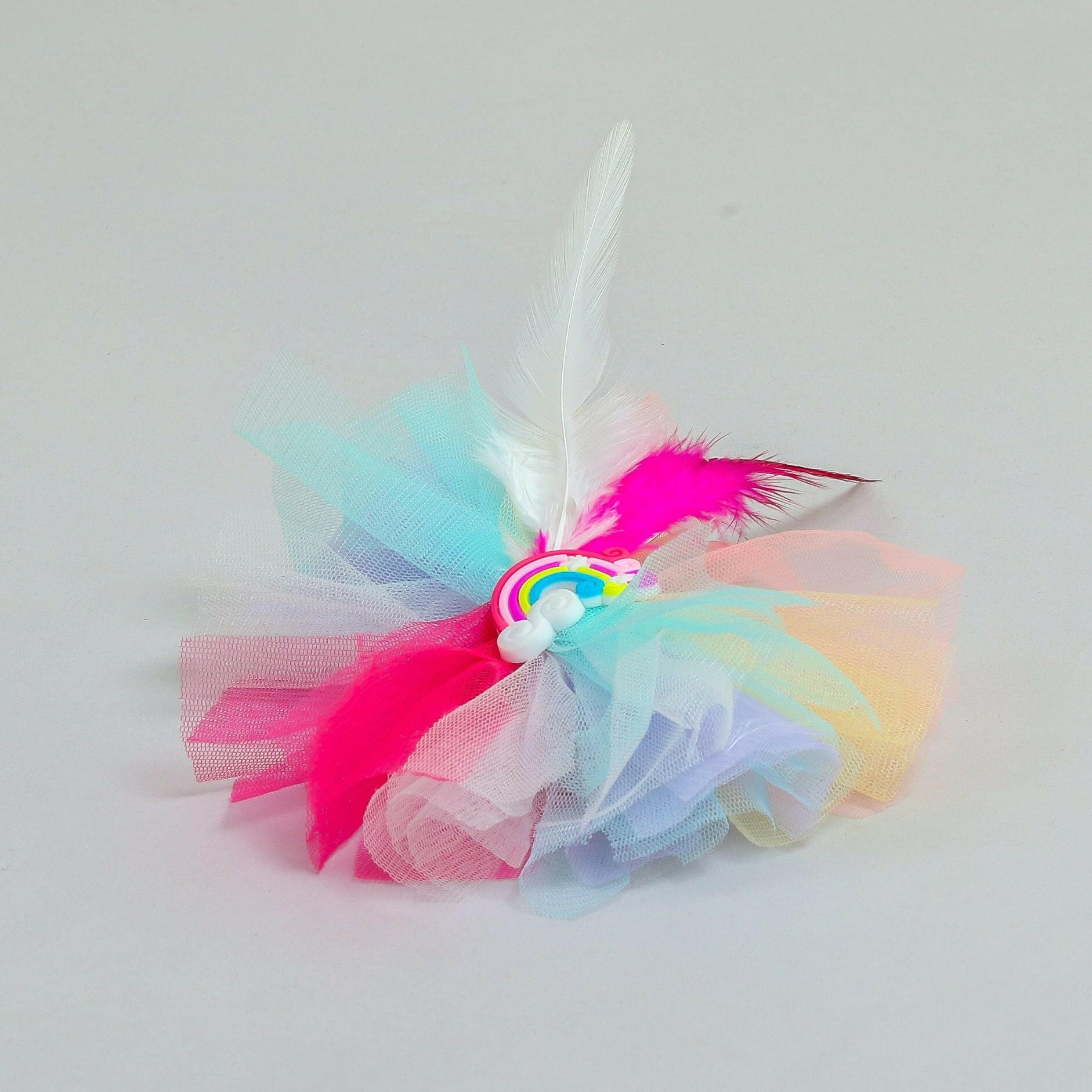 Pear Bear Beautiful rainbow adorned frilly hair clip.