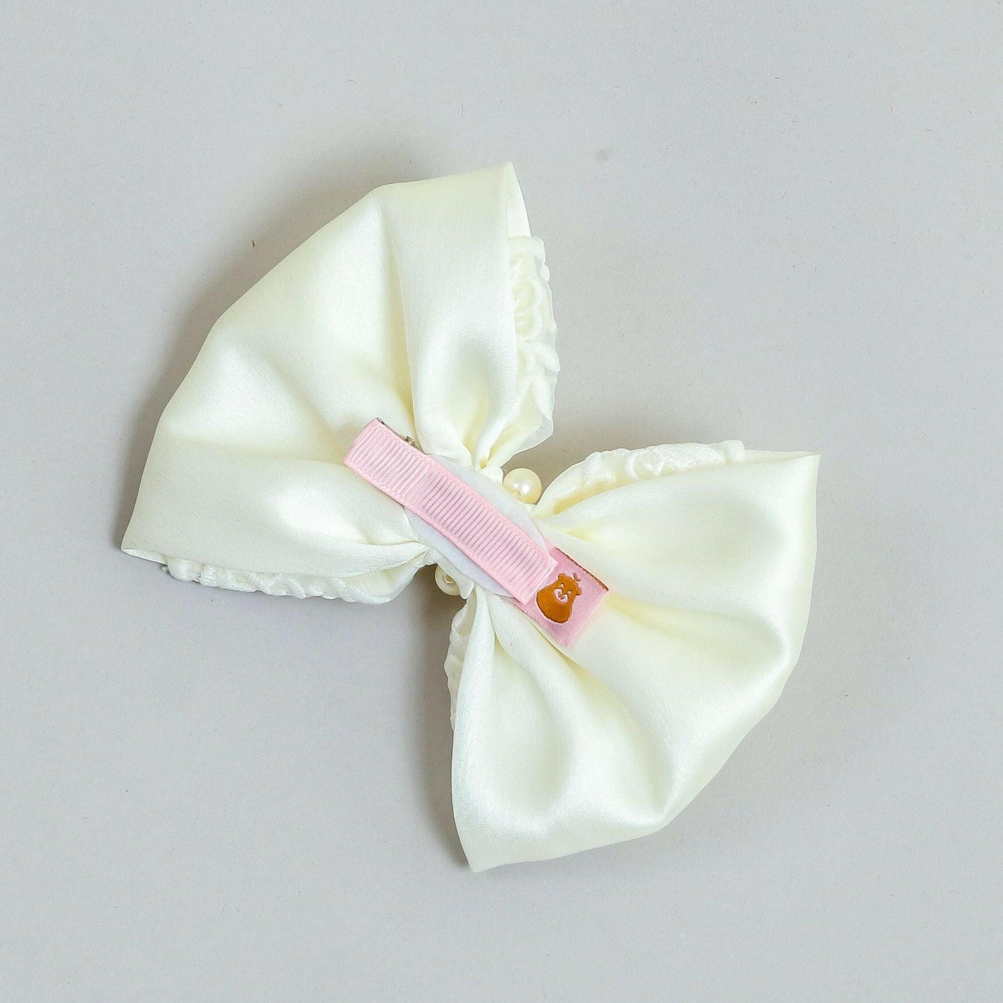 Pear Bear Elegant off white embroidered bow.