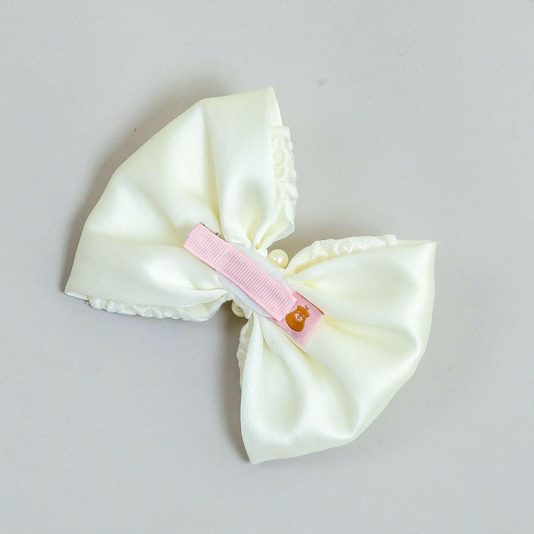 Pear Bear Elegant off white embroidered bow.
