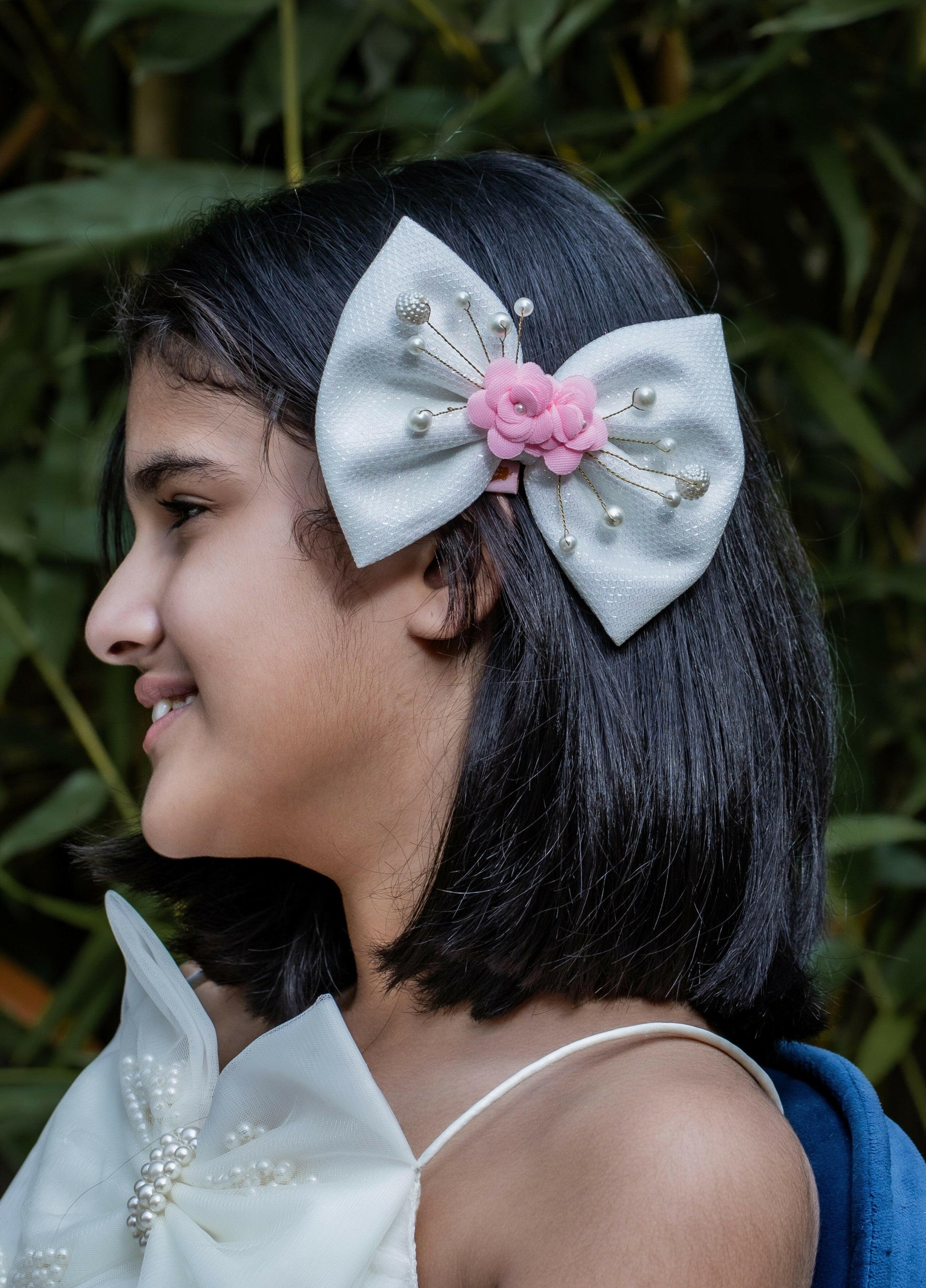 Pear Bear Shimmery flower and pearl adorned bow.