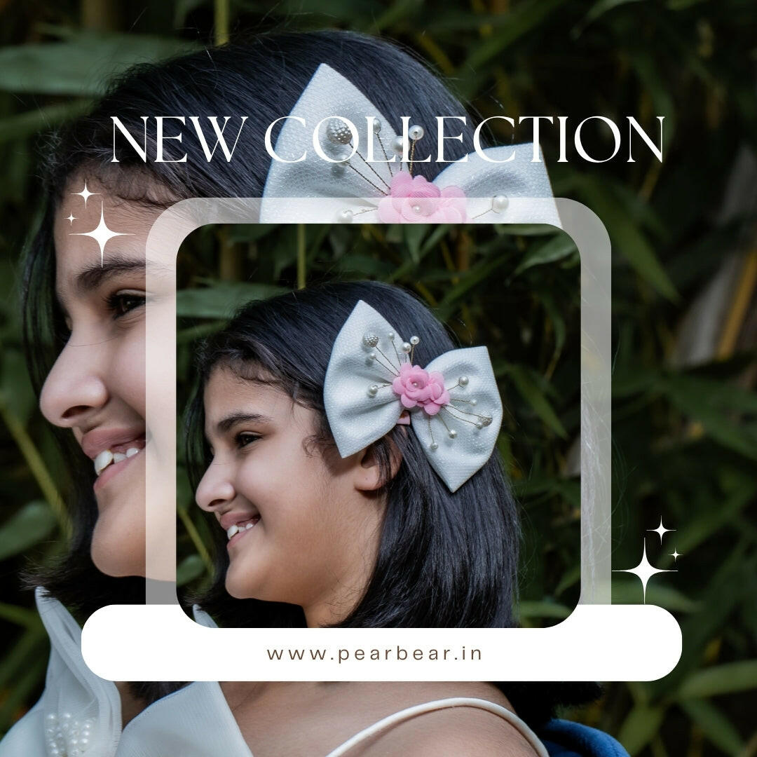 Pear Bear Shimmery flower and pearl adorned bow.