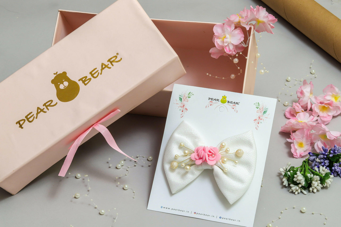 Pear Bear Shimmery flower and pearl adorned bow.