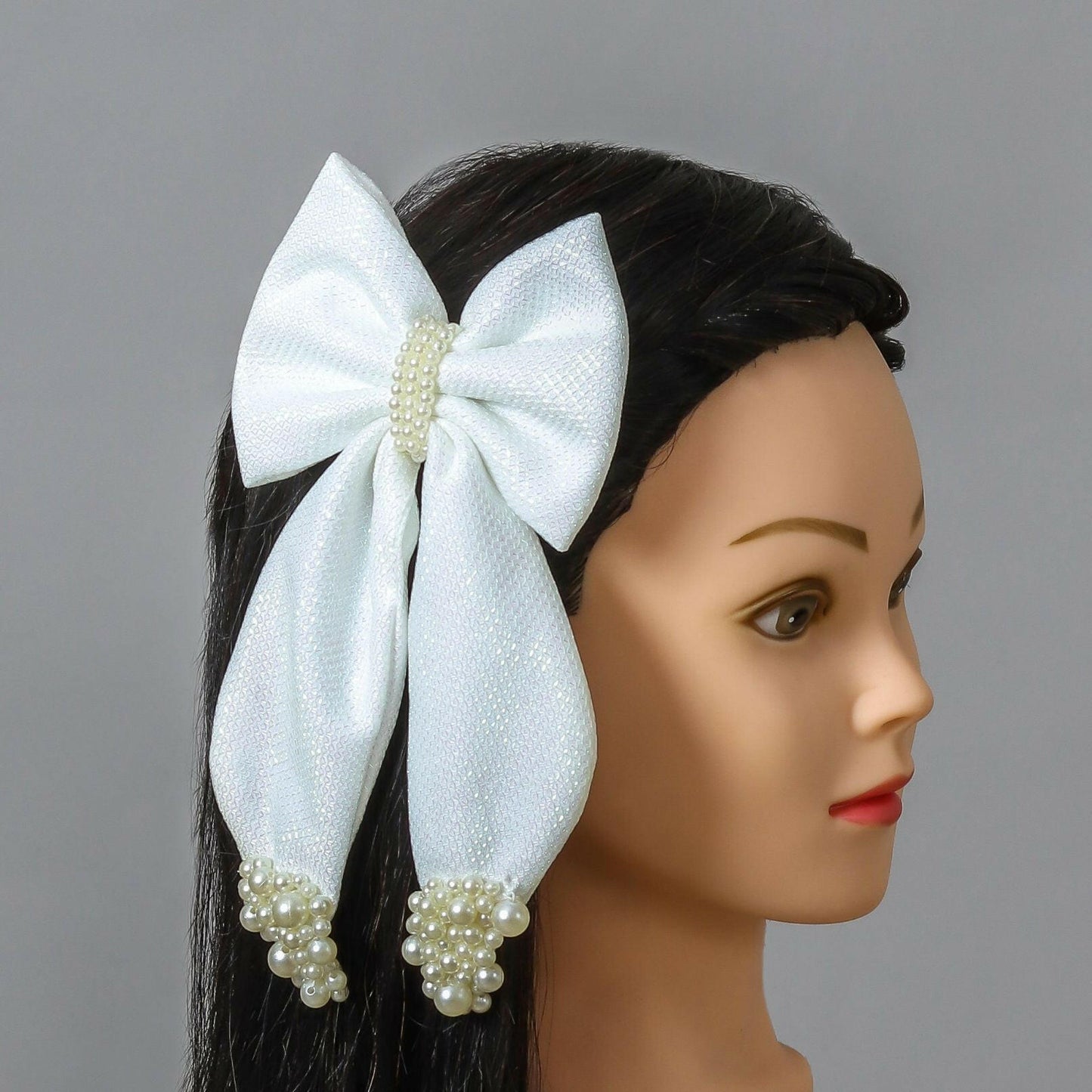 Pear Bear Shimmery pearl adorned beautiful pigtail bow.