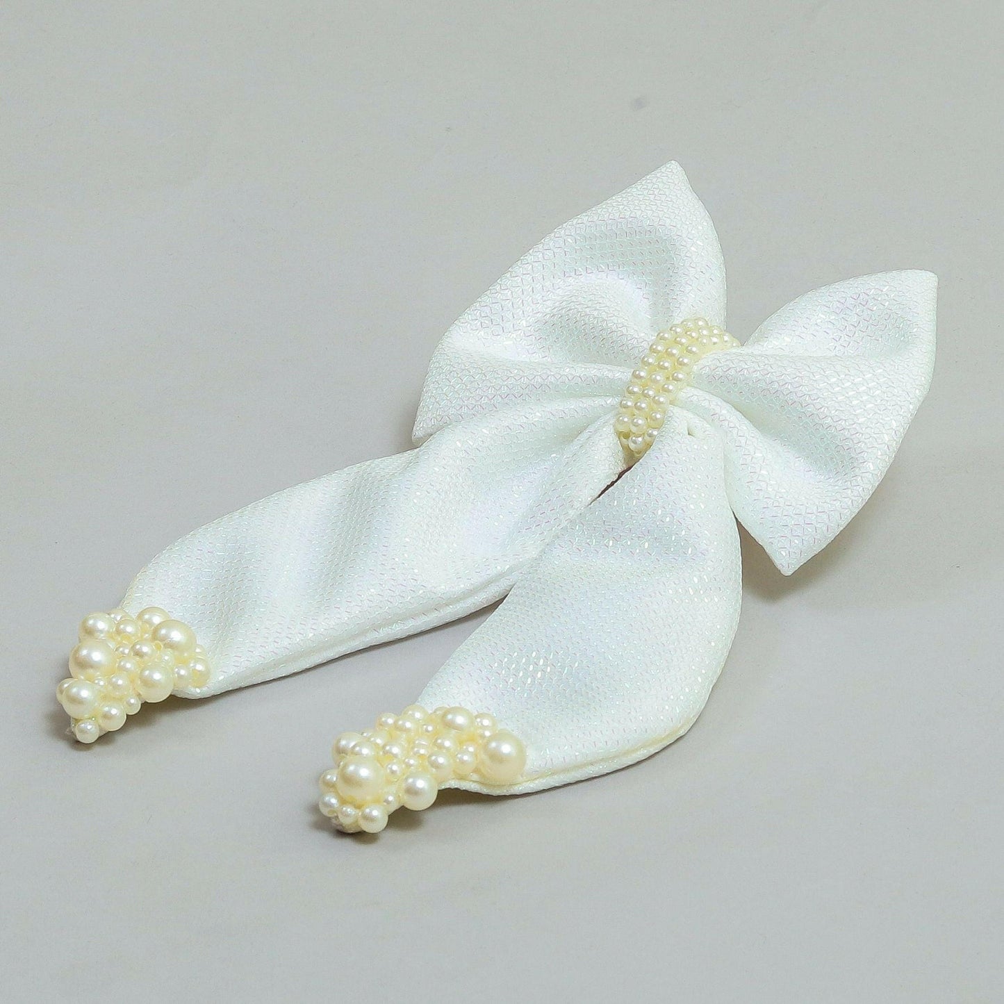Pear Bear Shimmery pearl adorned beautiful pigtail bow.