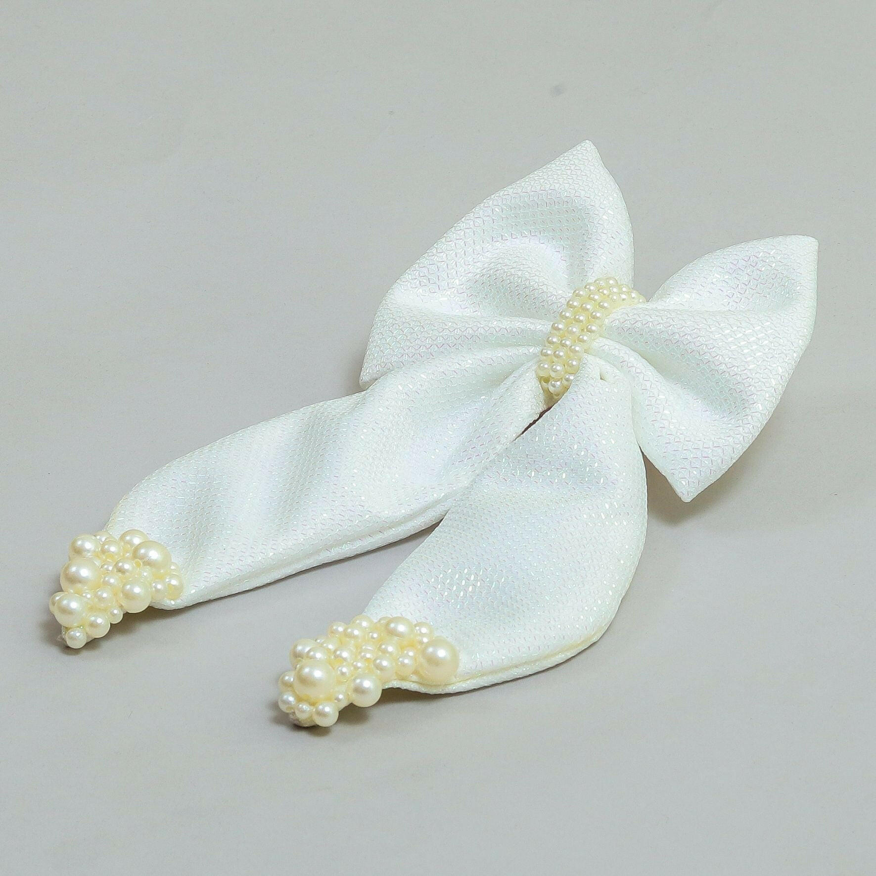 Pear Bear Shimmery pearl adorned beautiful pigtail bow.