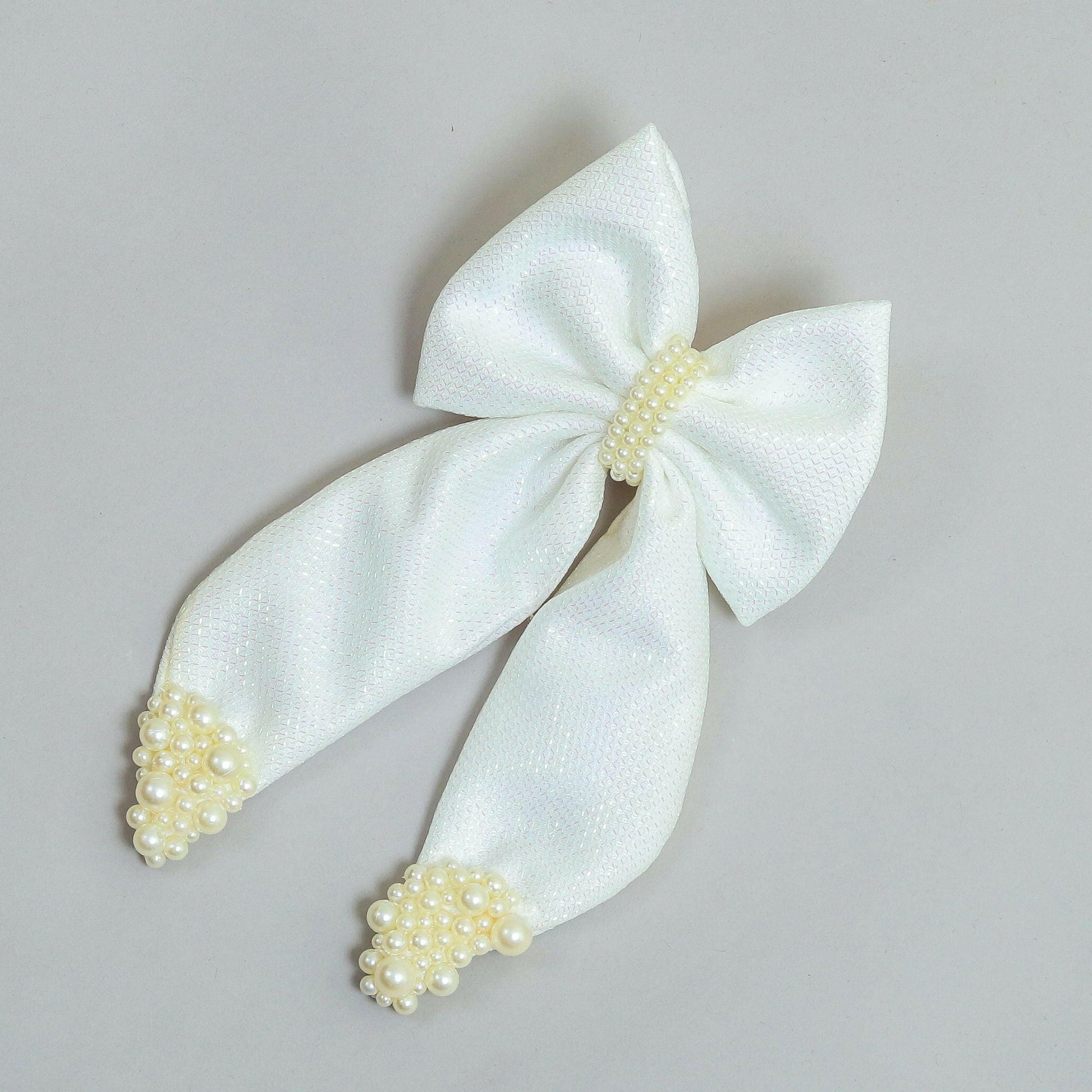 Pear Bear Shimmery pearl adorned beautiful pigtail bow.