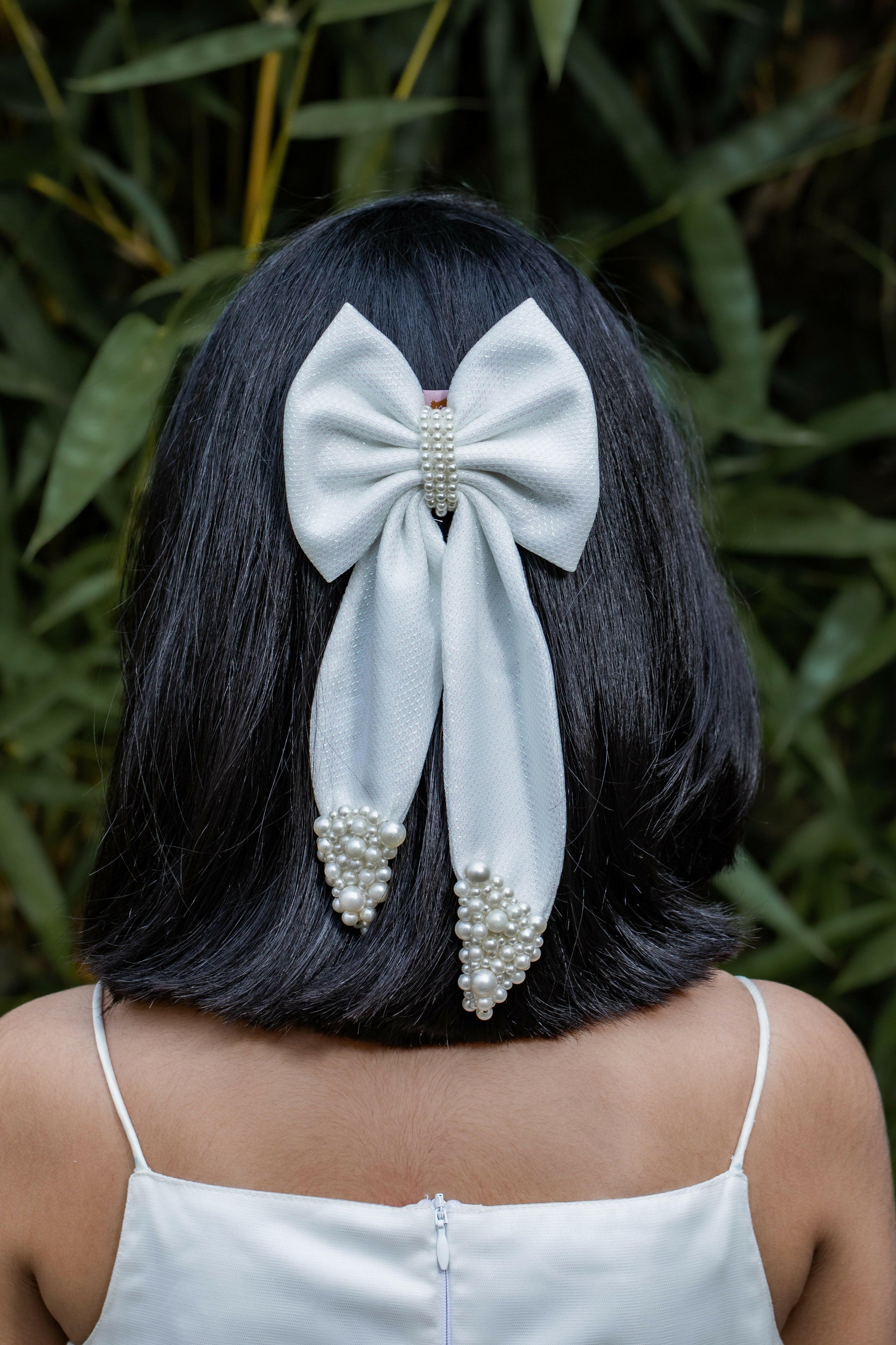 Pear Bear Shimmery pearl adorned beautiful pigtail bow.