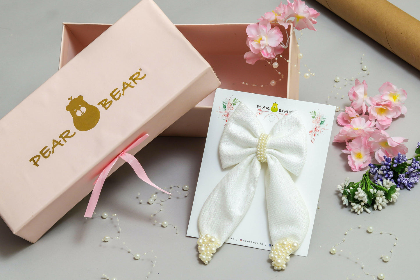 Pear Bear Shimmery pearl adorned beautiful pigtail bow.
